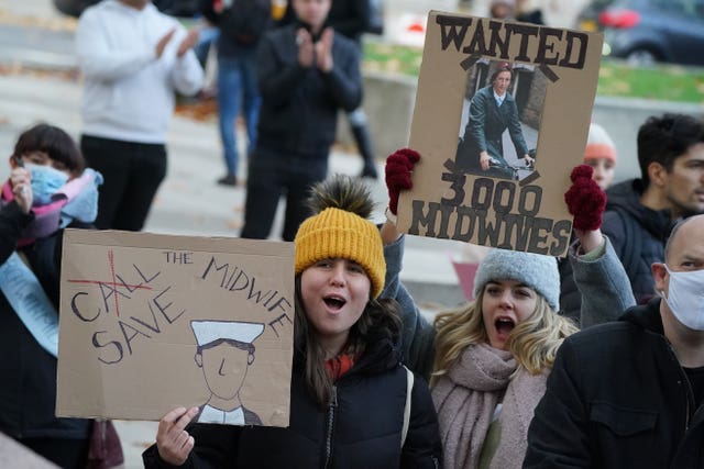 People take part in a ‘March with Midwives’ in central London (Dominic Lipinski/PA)