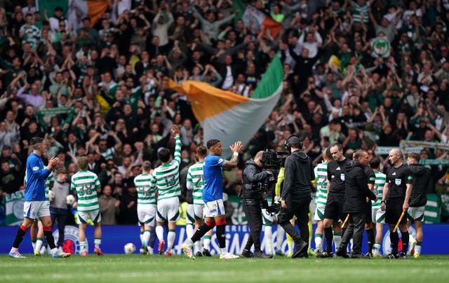 Rangers and Celtic players applaud their fans at Ibrox