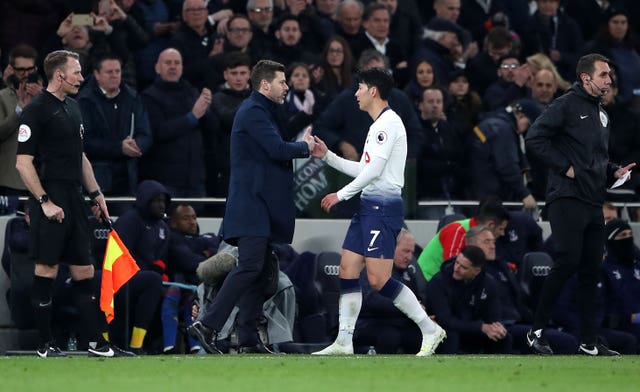 Tottenham Hotspur manager Mauricio Pochettino congratulates team-mate Son Heung-min