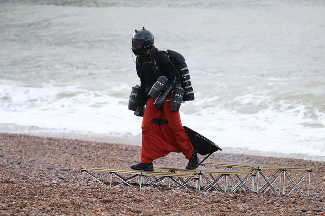 Richard Browning in his body-controlled, jet engine-powered suit near Brighton Pier