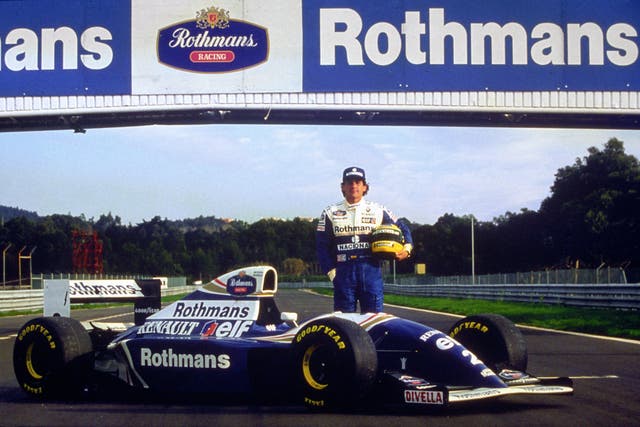 Ayrton Senna stands by his new Rothmans Williams Renault during testing in Portugal in 1994 