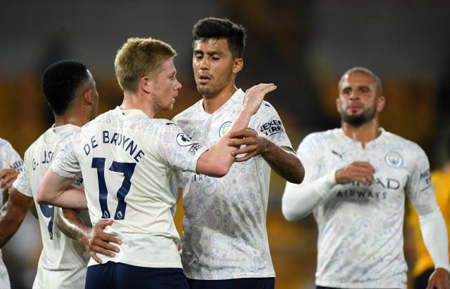 De Bruyne (left) scored a penalty as City won 3-1 at Wolves