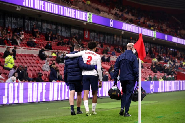 England's Trent Alexander-Arnold is helped down the touchline