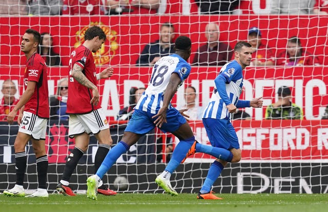 Pascal Gross celebrates after scoring against Manchester United (Martin Rickett/PA)