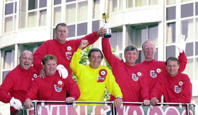 Seven of England’s 1966 World Cup winning team, including Roger Hunt, with a replica Jules Rimet trophy on an open top bus