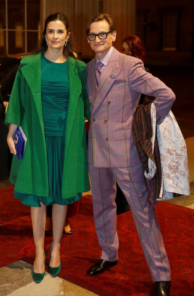 Livia Firth and Hamish Bowles, the curator of the exhibition (Peter Nicholls/PA)