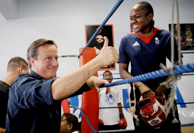 Adams met then-Prime Minister David Cameron during a training session in Brazil