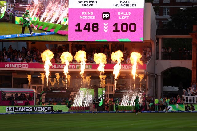 Southern Brave head out to bat during The Hundred Men’s Final with the scoreboard showing 148 runs needed from 100 balls