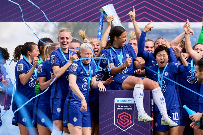 Chelsea celebrate with the FA Women’s Super League trophy