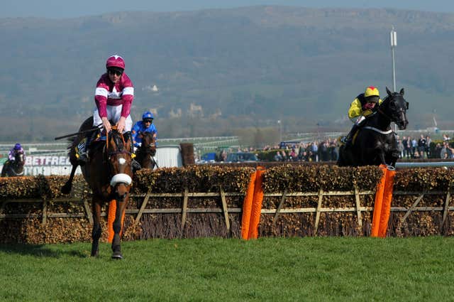 Tiger Roll (left) on his way to winning the Triumph Hurdle