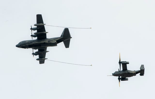 A Hercules (left) and an Osprey