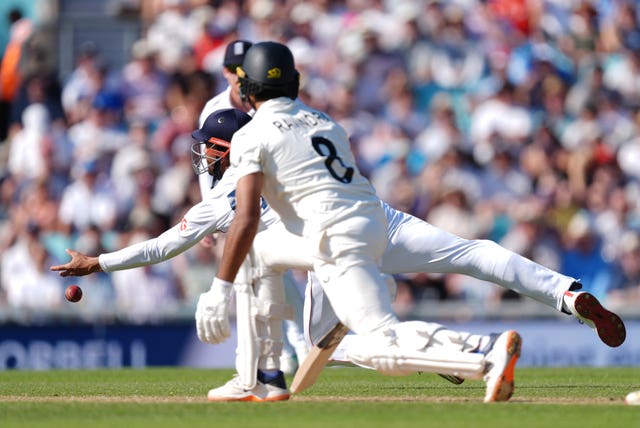 England’s Emilio Gay dives but fails to take the catch off New Zealand’s Rachin Ravindra, foreground