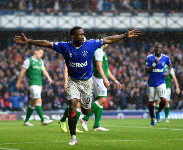 Jermain Defoe grabbed a hat-trick as Rangers crushed Hibs on Sunday