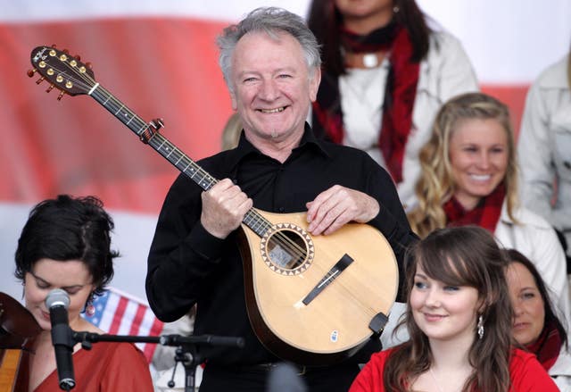 Dónal Lunny plays during a concert