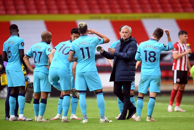 Tottenham manager Jose Mourinho speaks to his players during the second-half drinks break