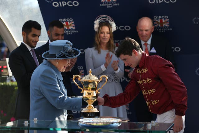 The Queen presents Oisin Muprhy with his prize after winning the QEII