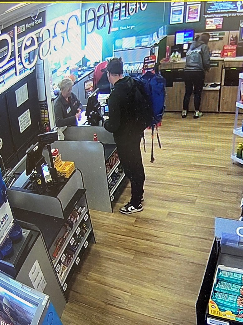 A CCTV still showing a backpack