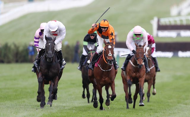 Put The Kettle On (middle) will try to defend her Champion Chase crown