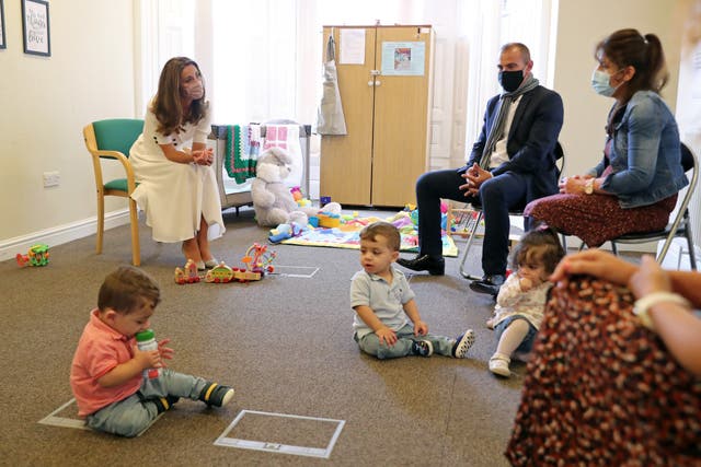Kate chats to the family of Ali Wartty and Sahara Hamawandy and their triplets San, Shan and Laveen, who have been supported by Baby Basics