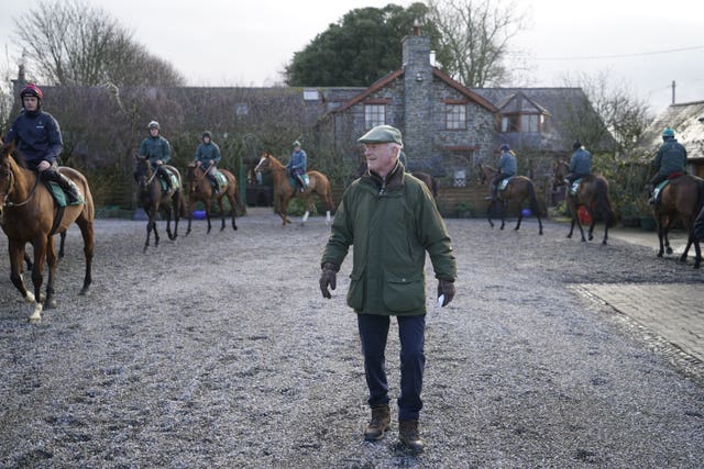 Willie Mullins surveys his string ahead of work