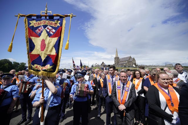 Orange men on parade