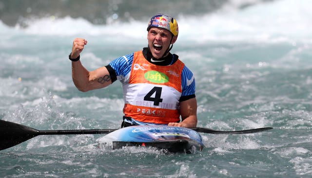 Great Britain’s Joseph Clarke celebrates victory in the Canoe Slalom World Cup