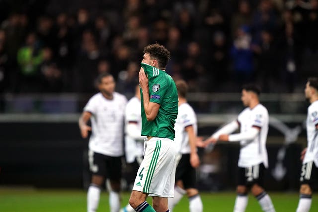 Tom Flanagan reacts after Julian Brandt makes it 6-1 to Germany