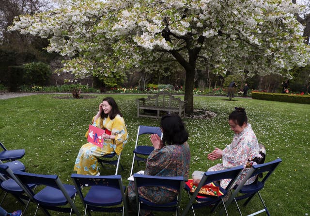 People take their seats for poetry reading