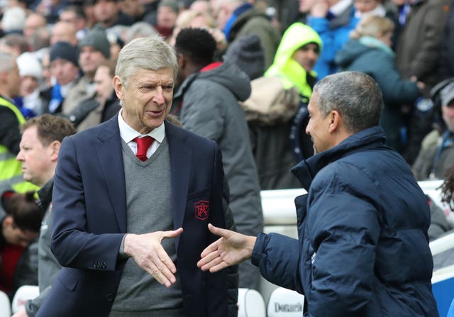 Arsene Wenger and Chris Hughton