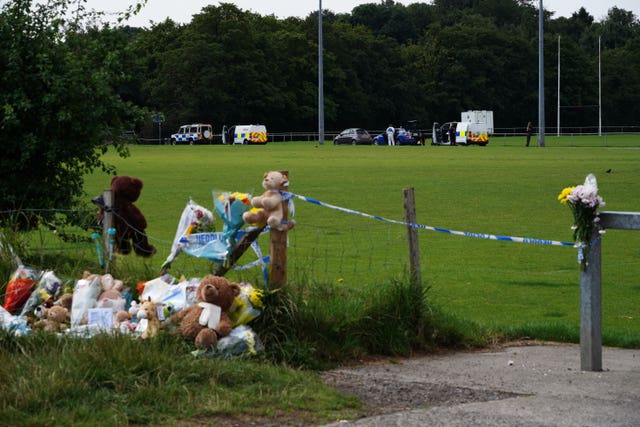 Tributes left at the scene in the Sarn area of Bridgend, South Wales, near to where five-year-old Logan Mwangi was found dead