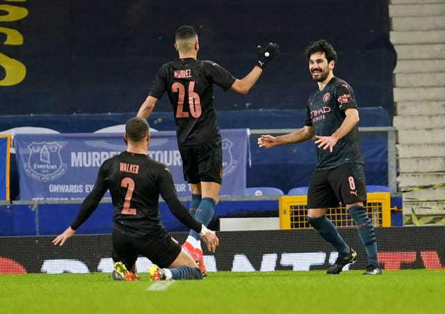 Ilkay Gundogan, right, opened the scoring for Manchester City as they defeated Everton in the FA Cup (Jon Super/PA)