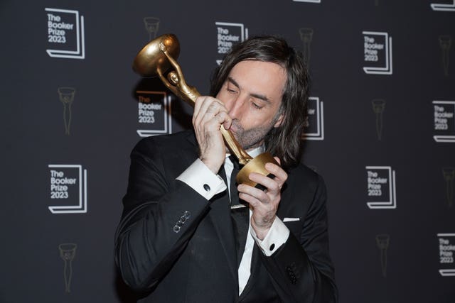 Paul Lynch kisses a trophy