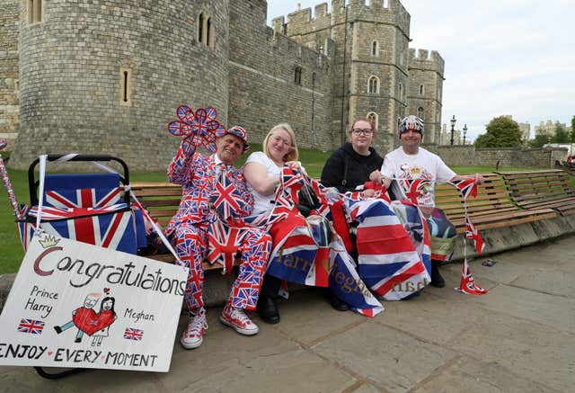 Royal fans gathering outside Windsor Castle ahead of the wedding (Steve Parsons/PA)