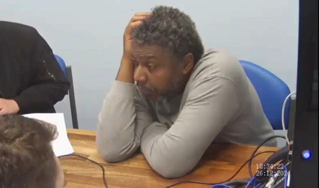 Jazwell Brown being questioned by police