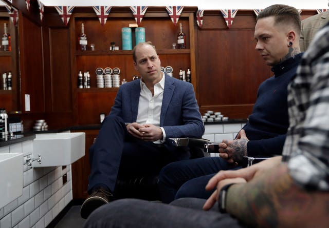 William meeting members of the Lion Barbers Collective, who are raising awareness of suicide prevention