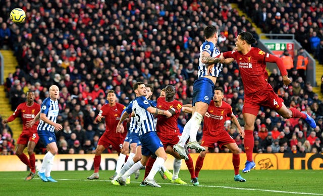 Virgil Van Dijk scored twice to give Liverpool victory over Brighton, moving them eight points clear at the top of the Premier League table