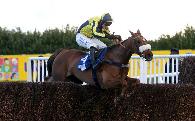 The Last Samuri and David Bass clear the final fence on their way to winning The BetBright Grimthorpe Chase at Doncaster