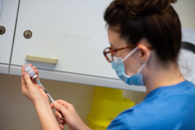 A nurse prepares the Moderna Covid-19 vaccine, at the West Wales General Hospital in Carmarthen