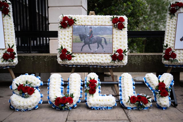 A photo and floral tribute to Lance Bombardier Ciara Sullivan
