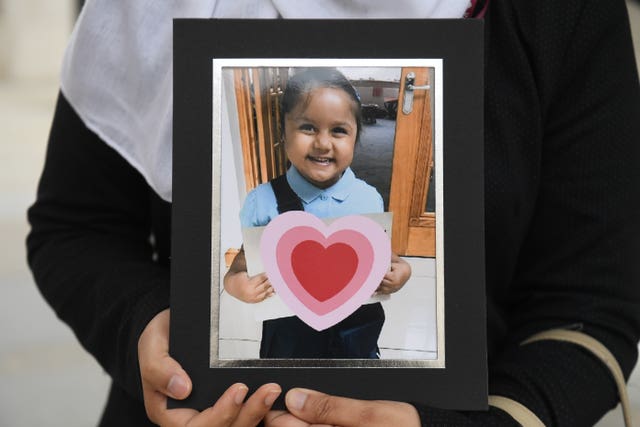 Shelina Begum holds a picture of her five-year-old daughter Tafida Raqeeb 