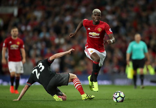 Pogba (right) rejoined United in 2016 for a then world-record £89.3million (Nick Potts/PA).