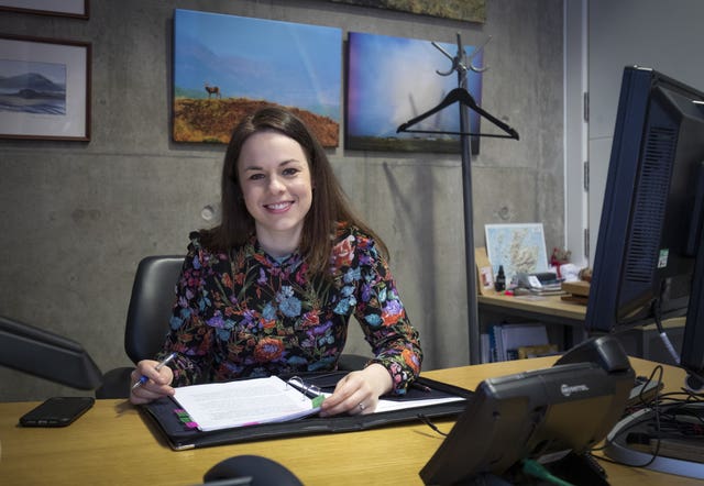 Kate Forbes working on the budget in her office.
