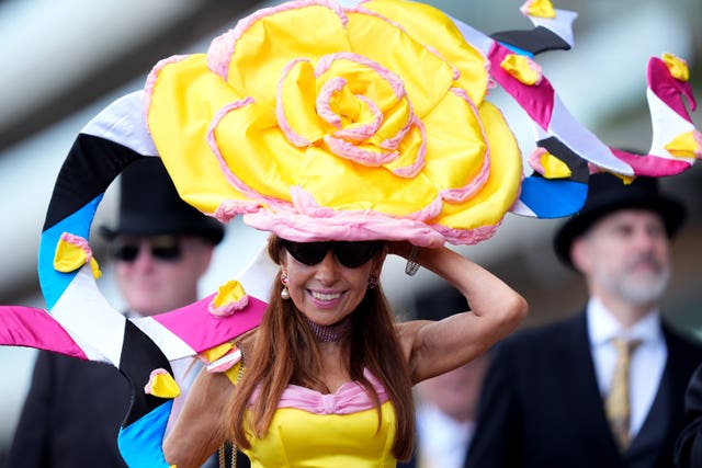 Woman in a large yellow flower hat