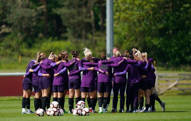 England's players in a huddle during a training session at St George's Park 