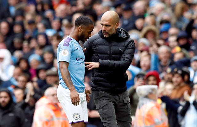 Pep Guardiola speaks to Raheem Sterling after he is substituted