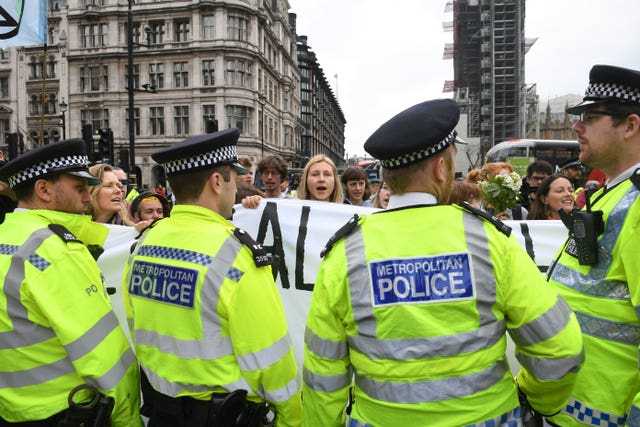 A small group of Extinction Rebellion protesters in Parliament Square in Westminster