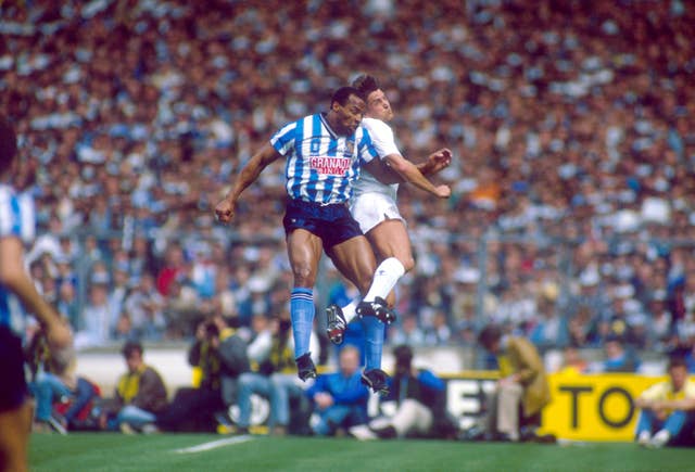 Regis, pictured contesting a header with Tottenham's Gary Mabbutt, played in the 1987 FA Cup final at Wembley which saw Coventry win 3-2 after extra time