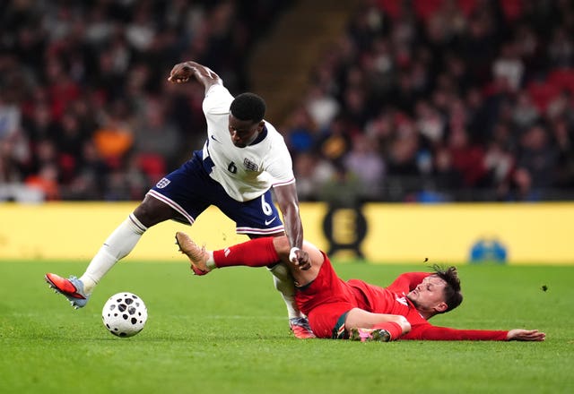England’s Marc Guehi (left) and Wales’ Liam Cullen battle for the ball