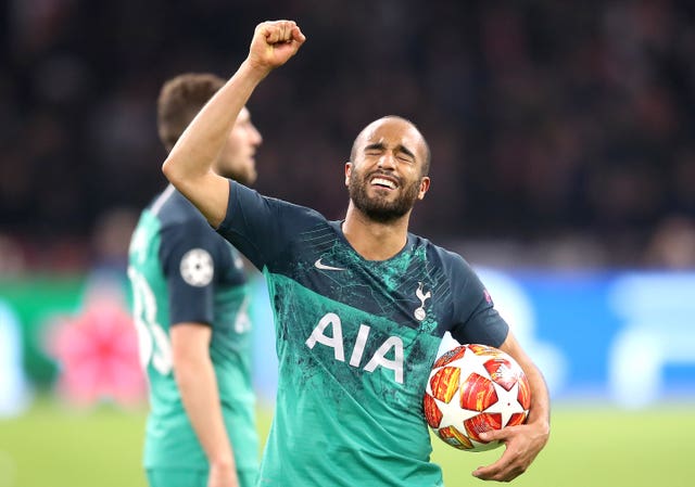 Lucas Moura celebrates with the match ball