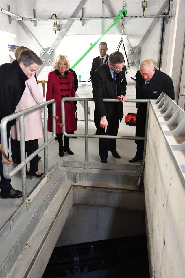 The Prince of Wales and Duchess of Cornwall inspect the shaft down to the tunnels during the opening of The National Grid's London Power Tunnels project in north London, a new electricity superhighway supplying power to the capital from deep below the streets. (John Stillwell/PA)